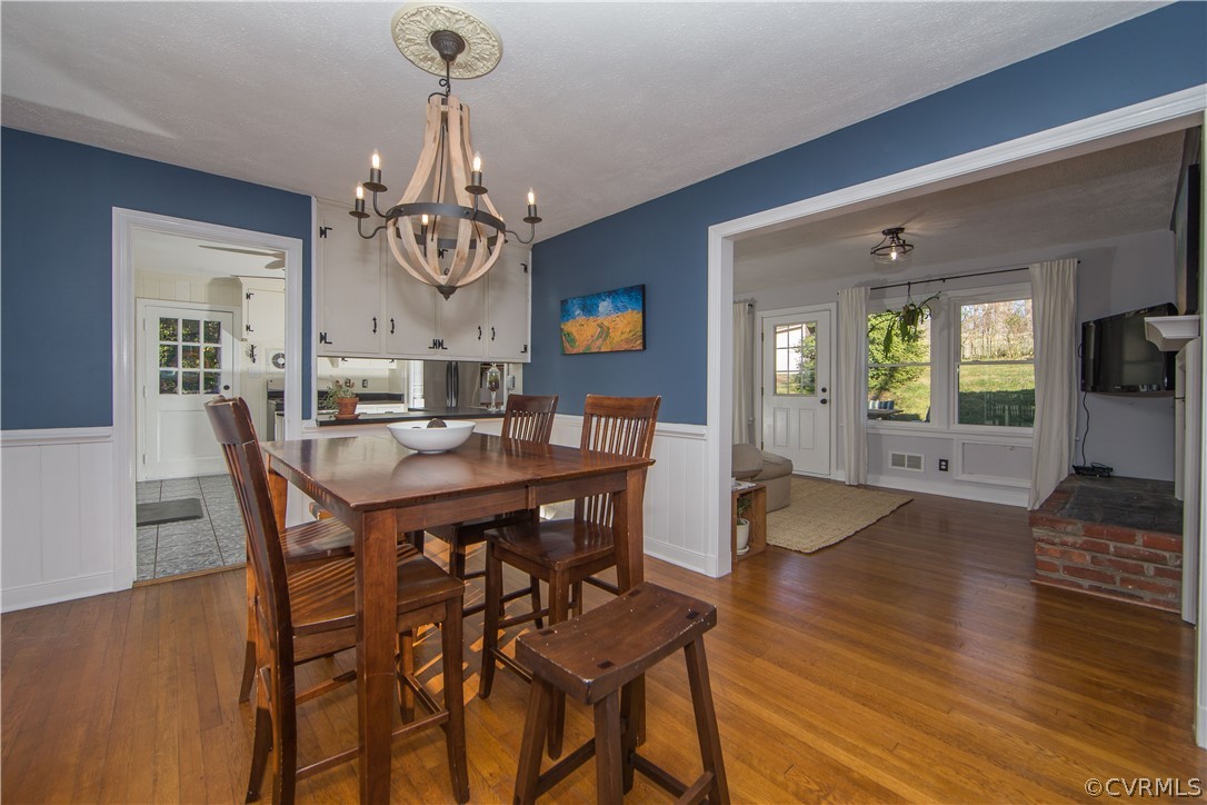 3921 Wakefield Road Richmond, VA 23235 - Photo 18 of 50 a view of a dining room with furniture wooden floor and chandelier