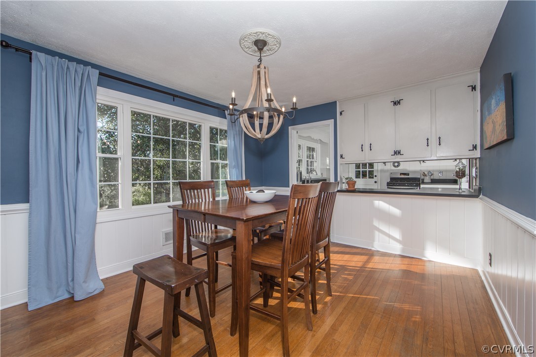 3921 Wakefield Road Richmond, VA 23235 - Photo 19 of 50 a view of a dining room with furniture window and wooden floor