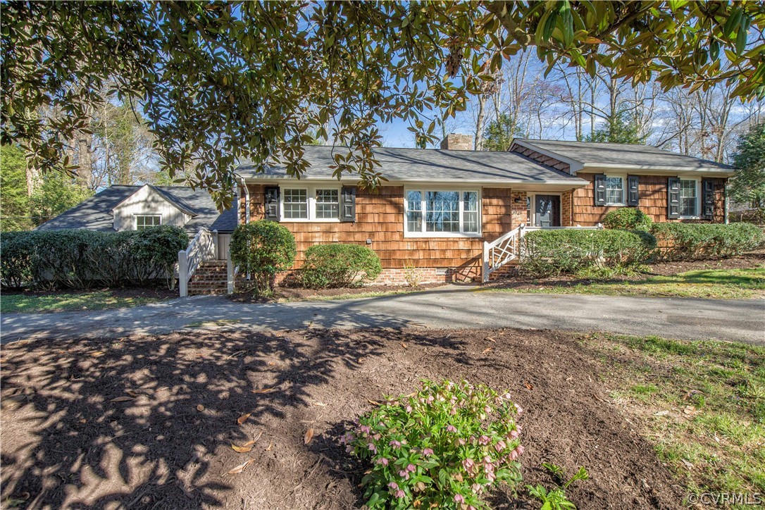 3921 Wakefield Road Richmond, VA 23235 - Photo 2 of 50 a front view of a house with a yard