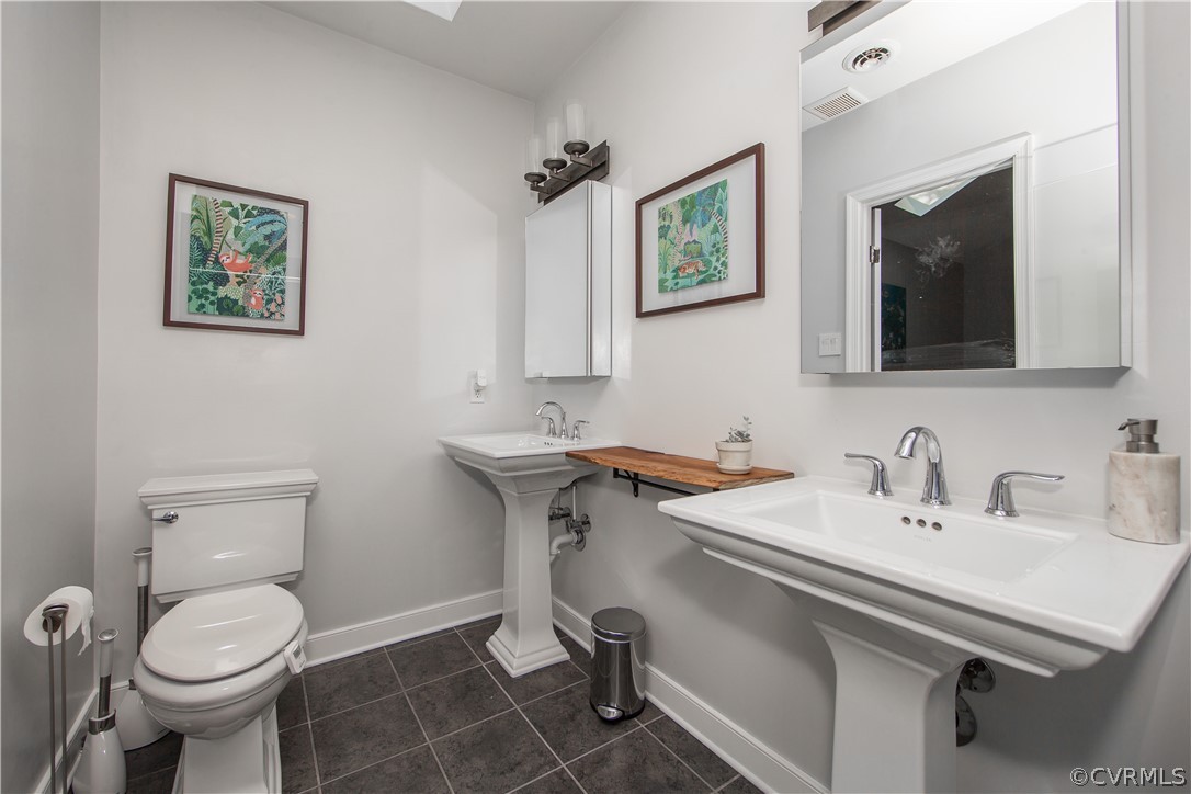 3921 Wakefield Road Richmond, VA 23235 - Photo 33 of 50 a bathroom with a sink mirror and toilet