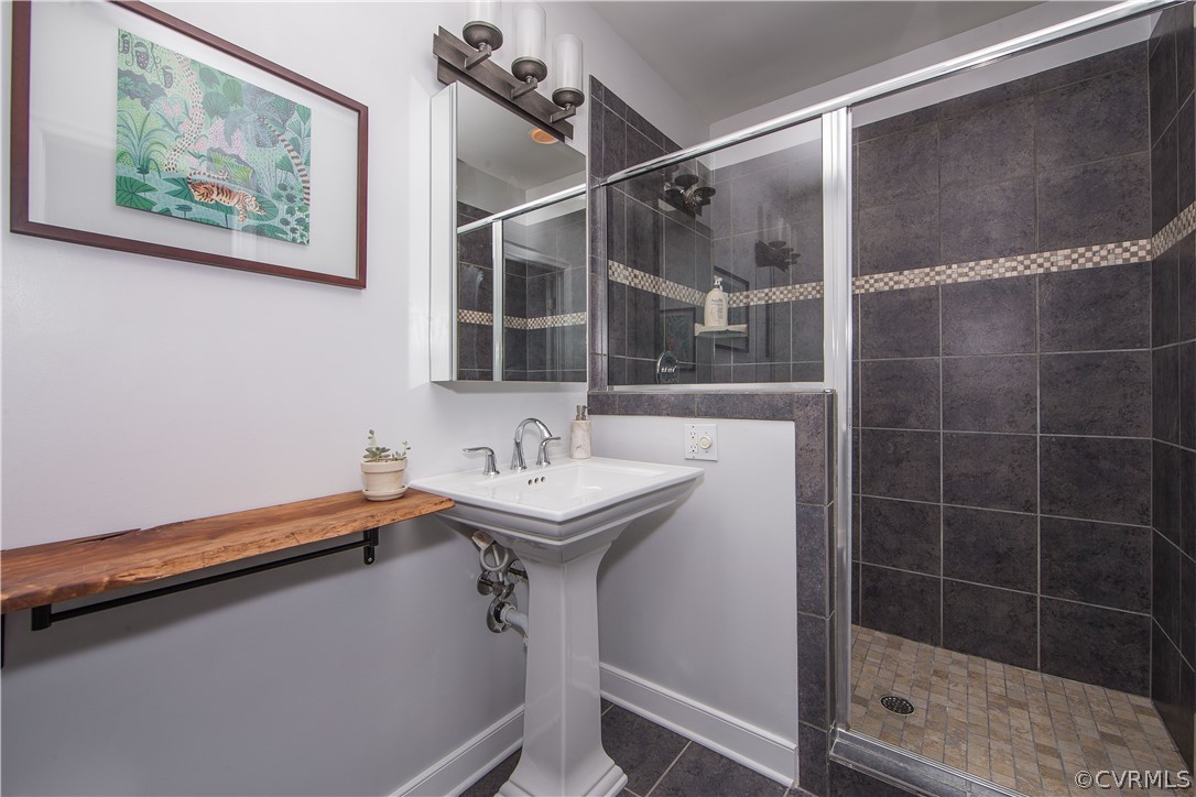 3921 Wakefield Road Richmond, VA 23235 - Photo 34 of 50 a bathroom with a sink and a mirror