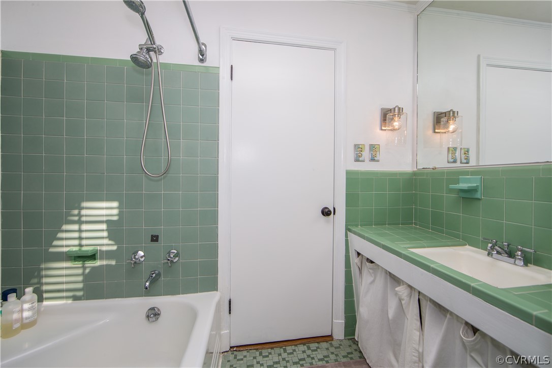 3921 Wakefield Road Richmond, VA 23235 - Photo 40 of 50 a bathroom with a granite countertop sink a toilet and bathtub