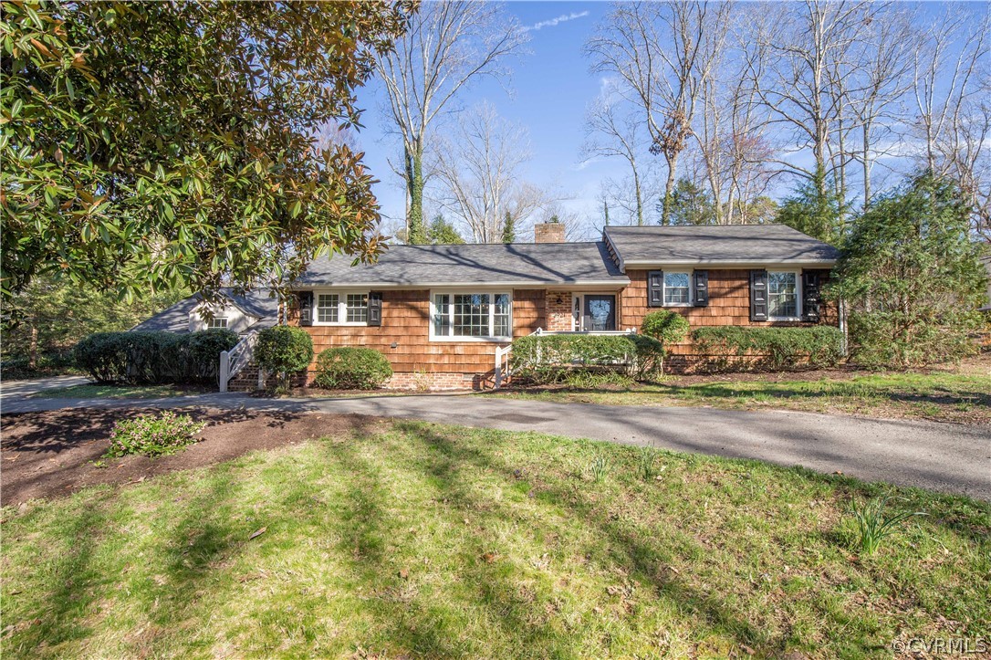 3921 Wakefield Road Richmond, VA 23235 - Photo 42 of 50 a front view of a house with a garden