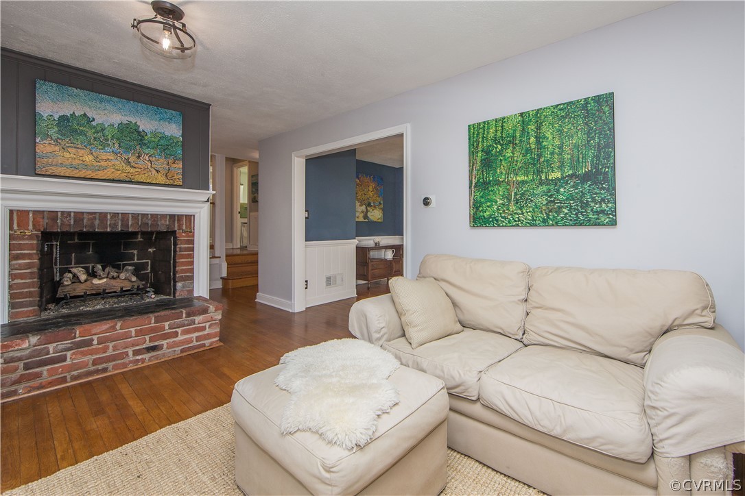 3921 Wakefield Road Richmond, VA 23235 - Photo 7 of 50 a living room with furniture and a fireplace