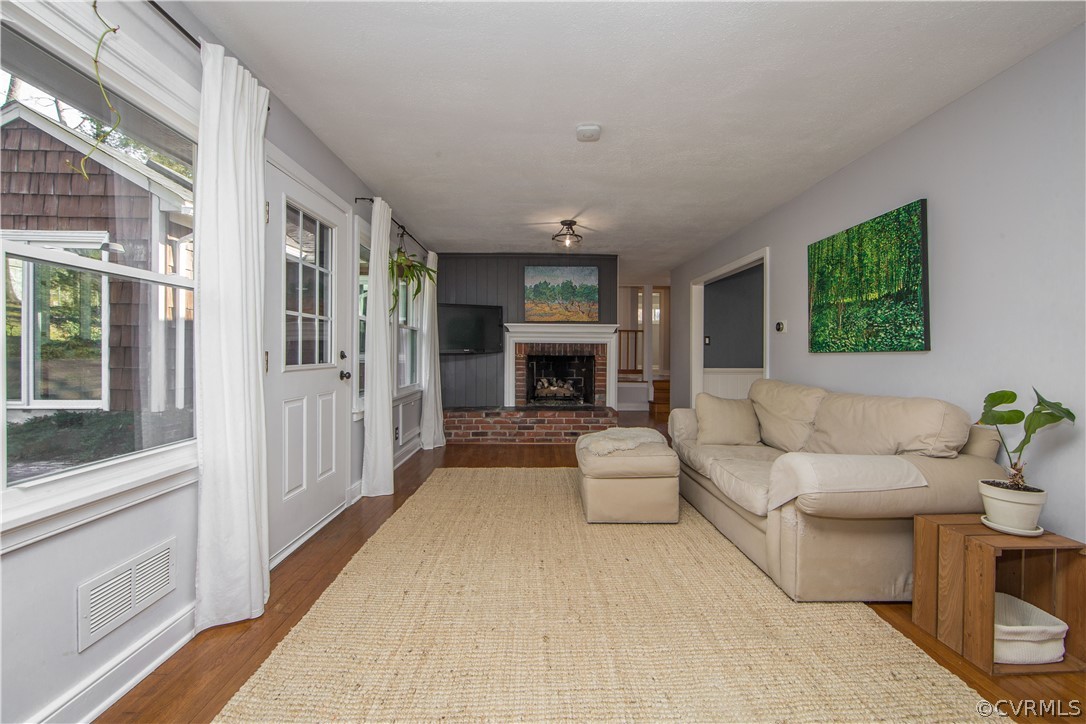 3921 Wakefield Road Richmond, VA 23235 - Photo 8 of 50 a living room with furniture and a fireplace