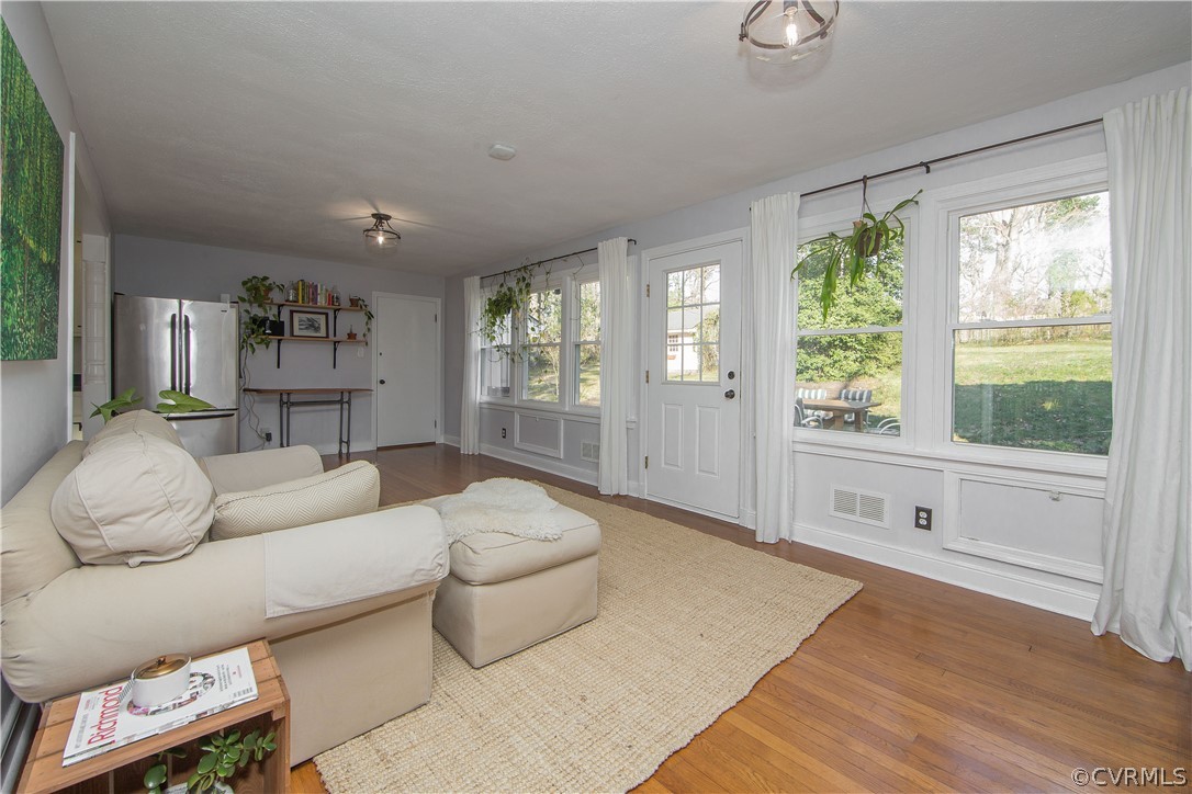 3921 Wakefield Road Richmond, VA 23235 - Photo 9 of 50 a living room with furniture and a large window