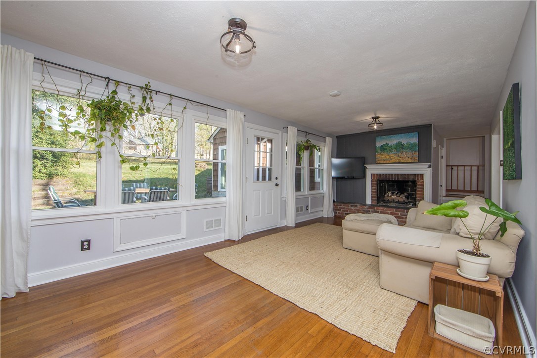3921 Wakefield Road Richmond, VA 23235 - Photo 10 of 50 a living room with furniture fireplace and window