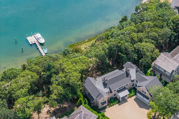 an aerial view of a house with outdoor space and street view
