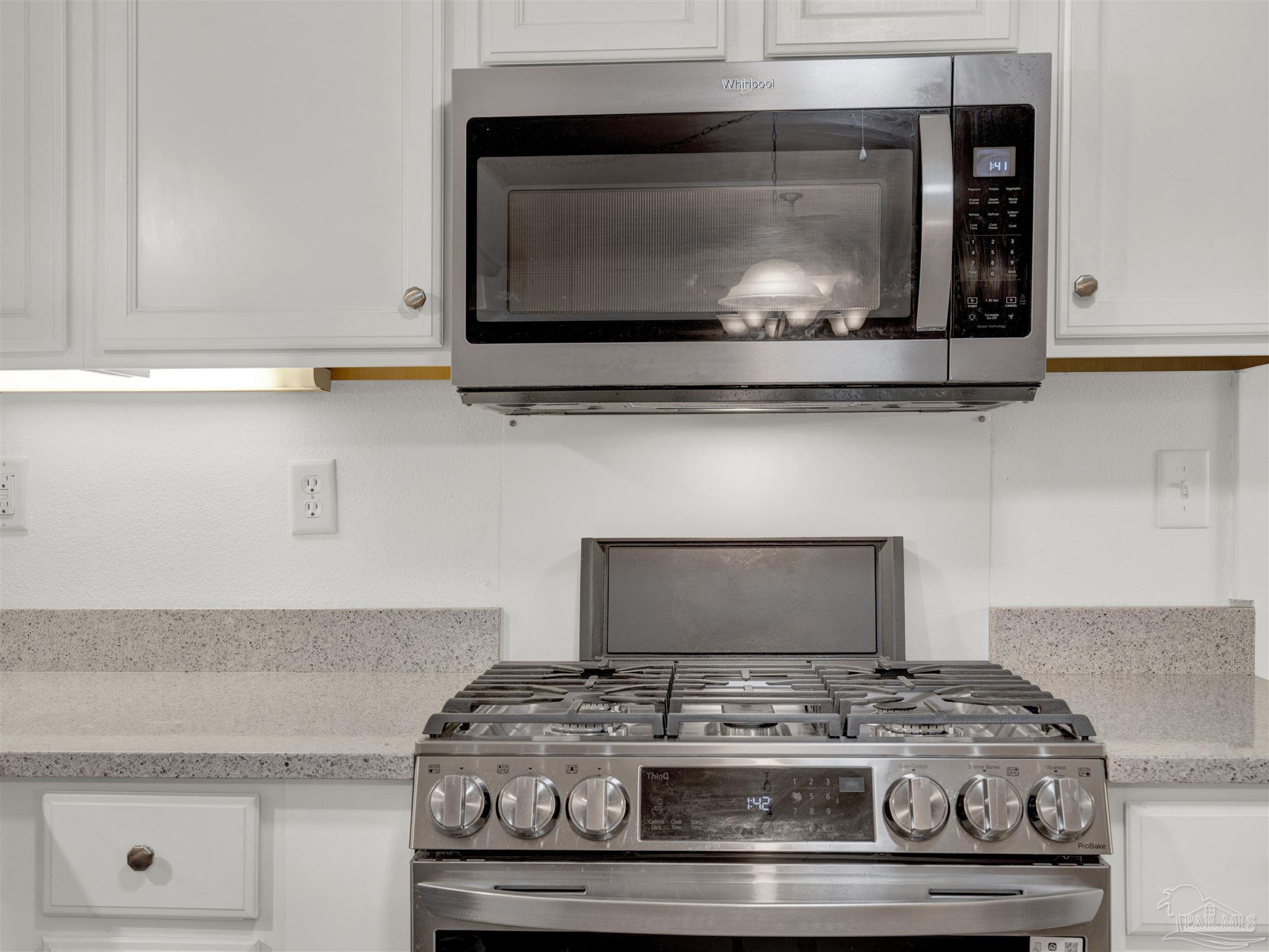 111 Euclid Road Pensacola, FL 32503 - Photo 11 of 34 a stove top oven sitting inside of a kitchen