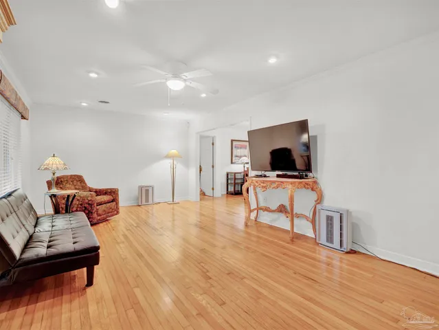 a front view of house with yard and trees in the background