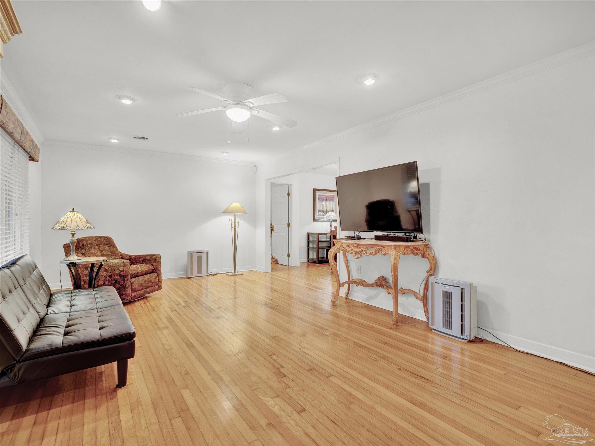 111 Euclid Road Pensacola, FL 32503 - Photo 12 of 34 a living room with furniture and a flat screen tv