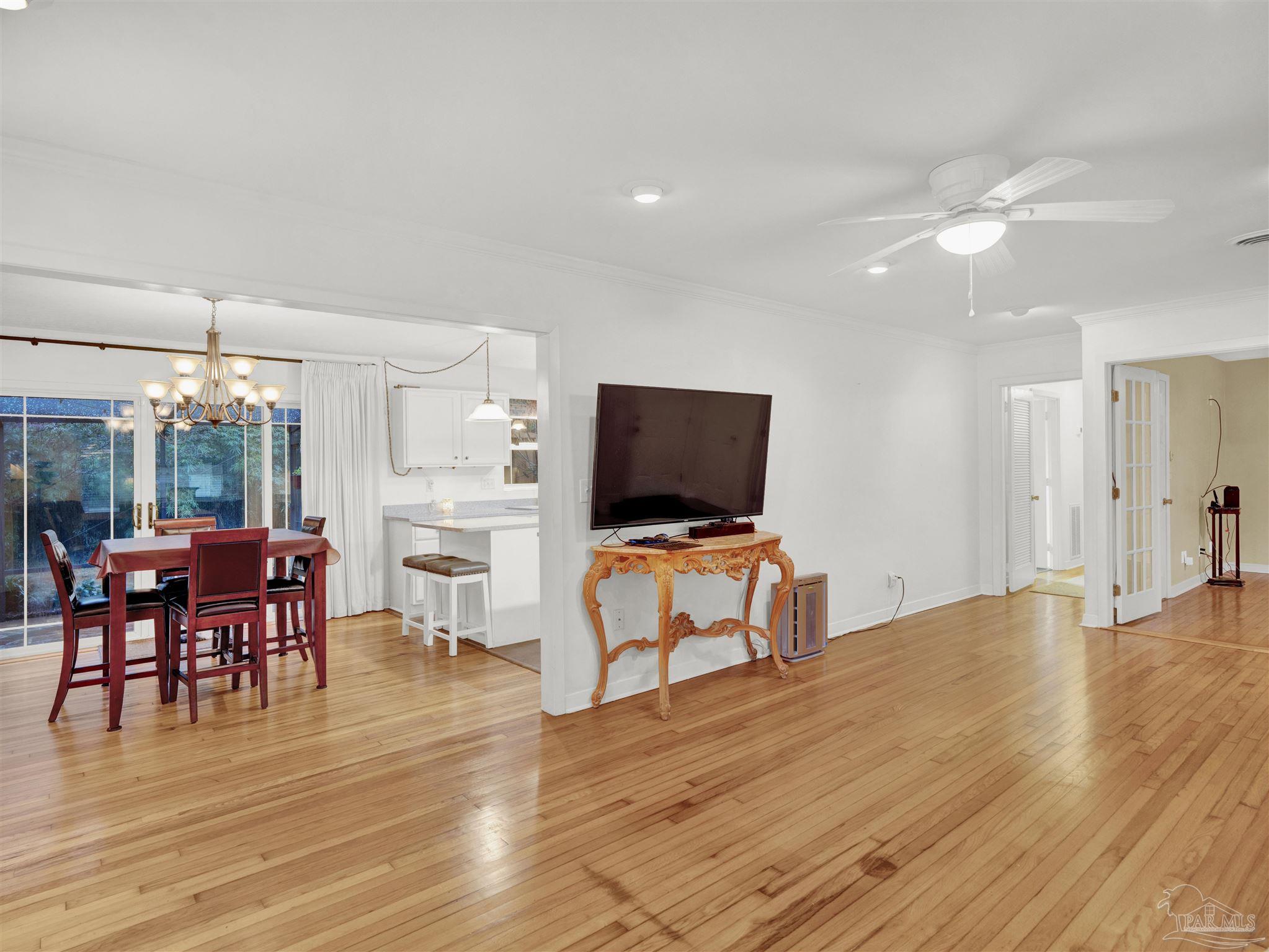 111 Euclid Road Pensacola, FL 32503 - Photo 14 of 34 a view of a livingroom with furniture and a flat screen tv