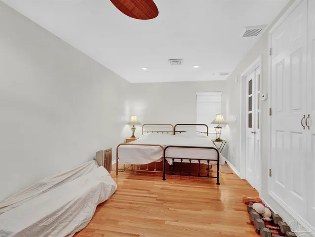 a view of a dining room with furniture large wooden floor and chandelier