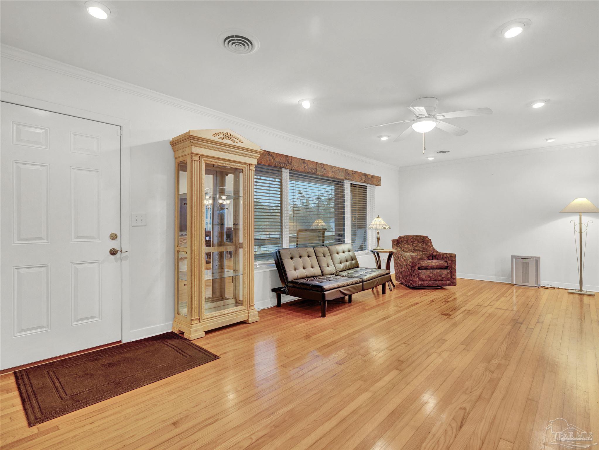 111 Euclid Road Pensacola, FL 32503 - Photo 24 of 34 a living room with furniture and a large window