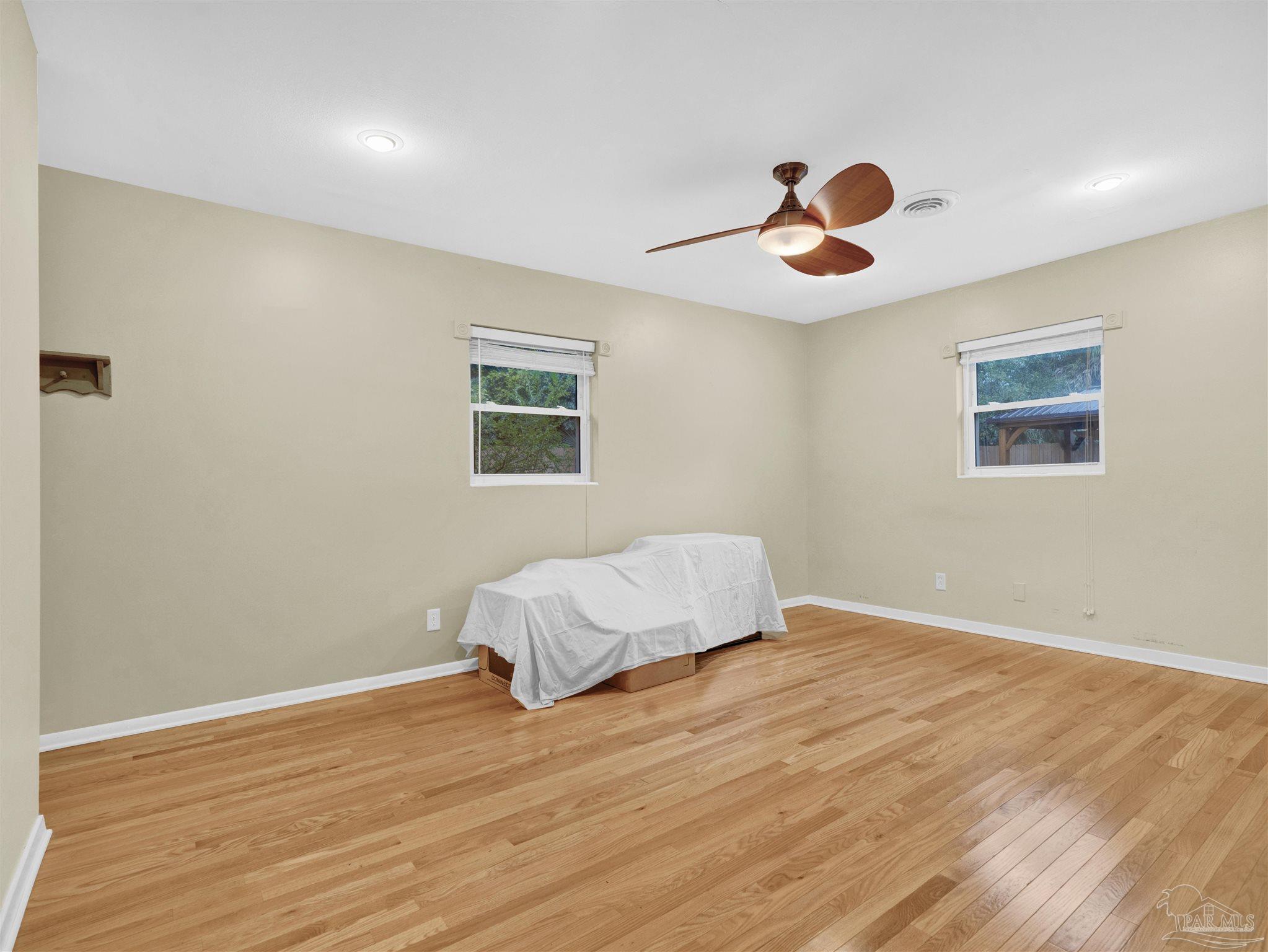 111 Euclid Road Pensacola, FL 32503 - Photo 26 of 34 a bedroom with a bed and a window