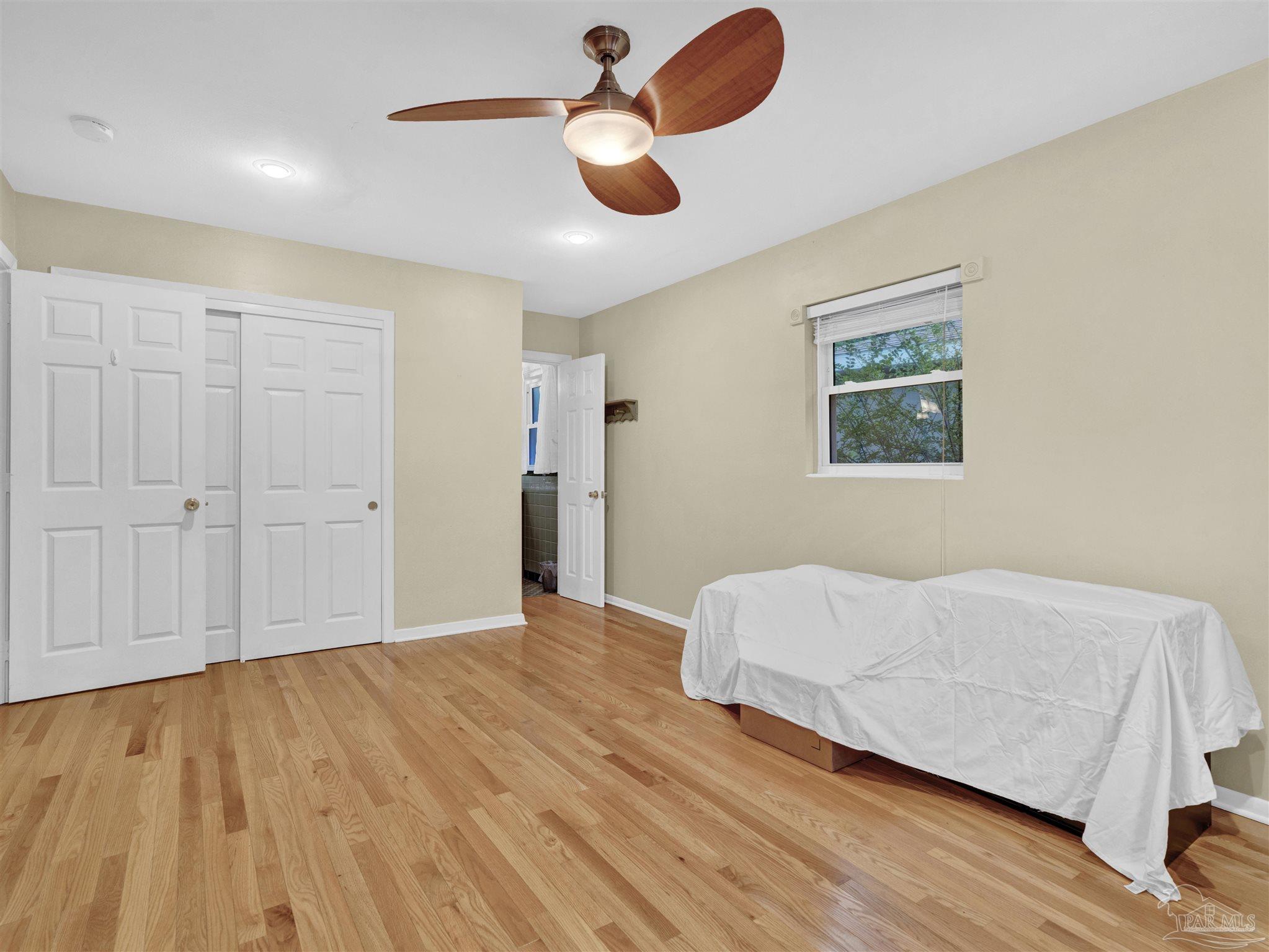111 Euclid Road Pensacola, FL 32503 - Photo 27 of 34 a bedroom with a bed and cabinets