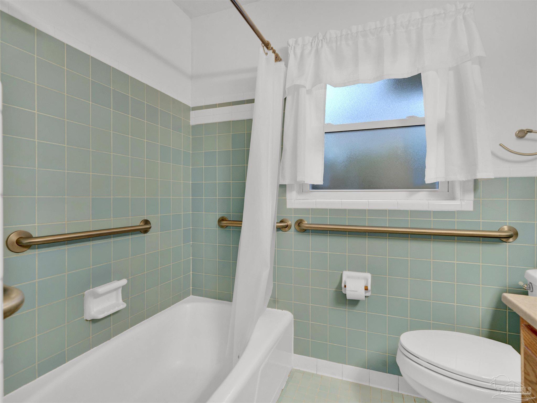 111 Euclid Road Pensacola, FL 32503 - Photo 29 of 34 a bathroom with a sink and a mirror