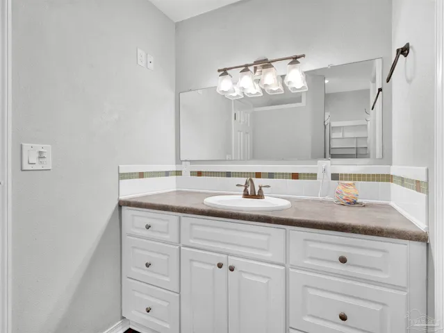 a stove top oven sitting inside of a kitchen