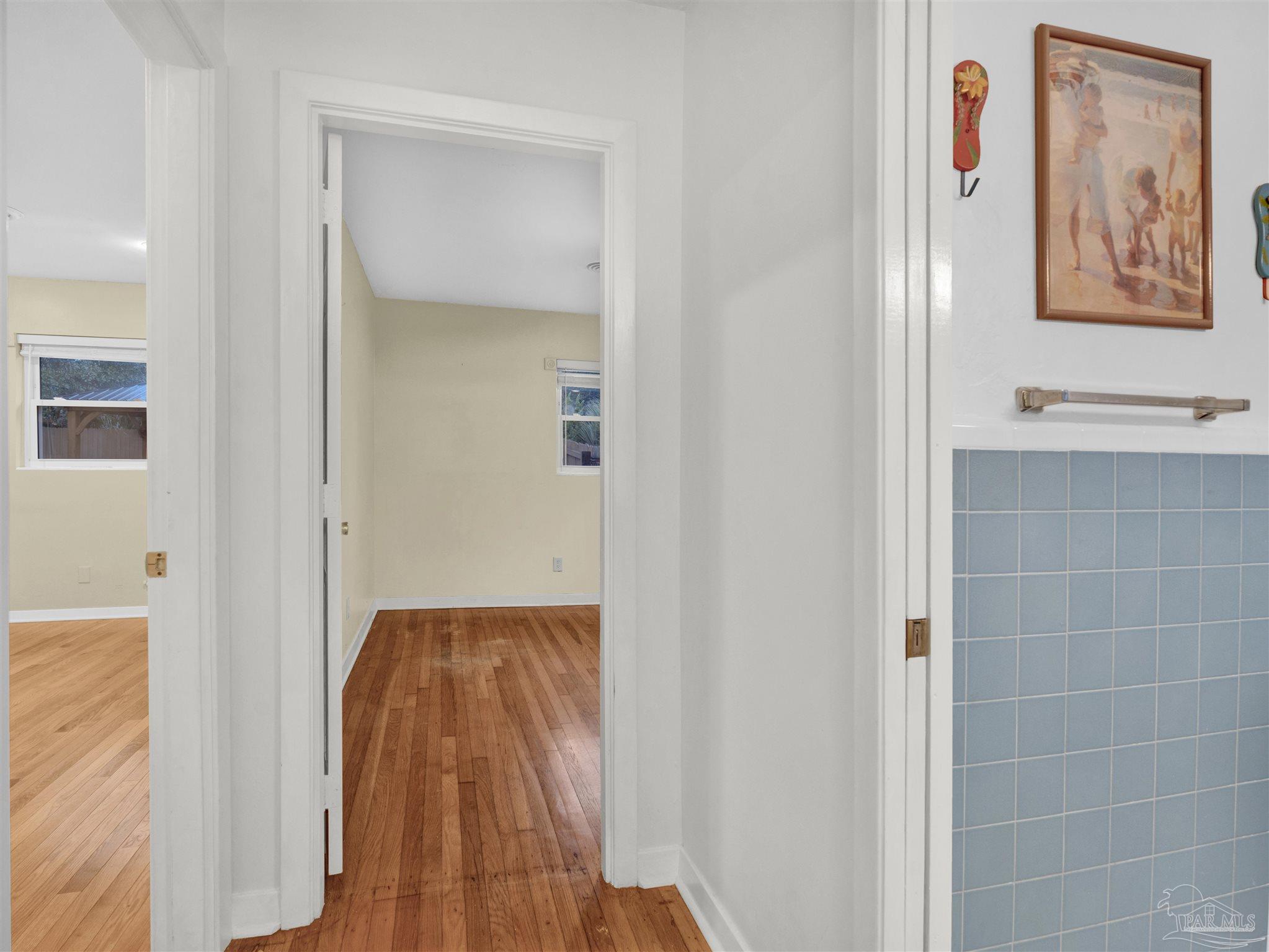 111 Euclid Road Pensacola, FL 32503 - Photo 31 of 34 a view of a hallway with wooden floor and closet