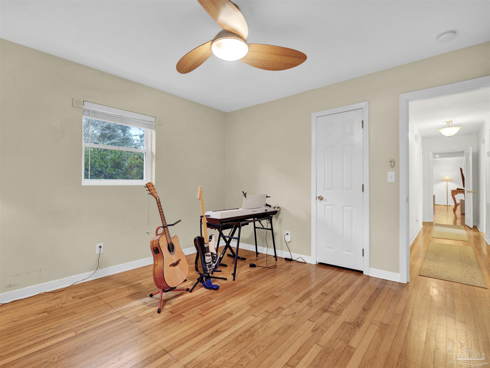 111 Euclid Road Pensacola, FL 32503 - Photo 32 of 34 a view of a workspace with furniture and wooden floor
