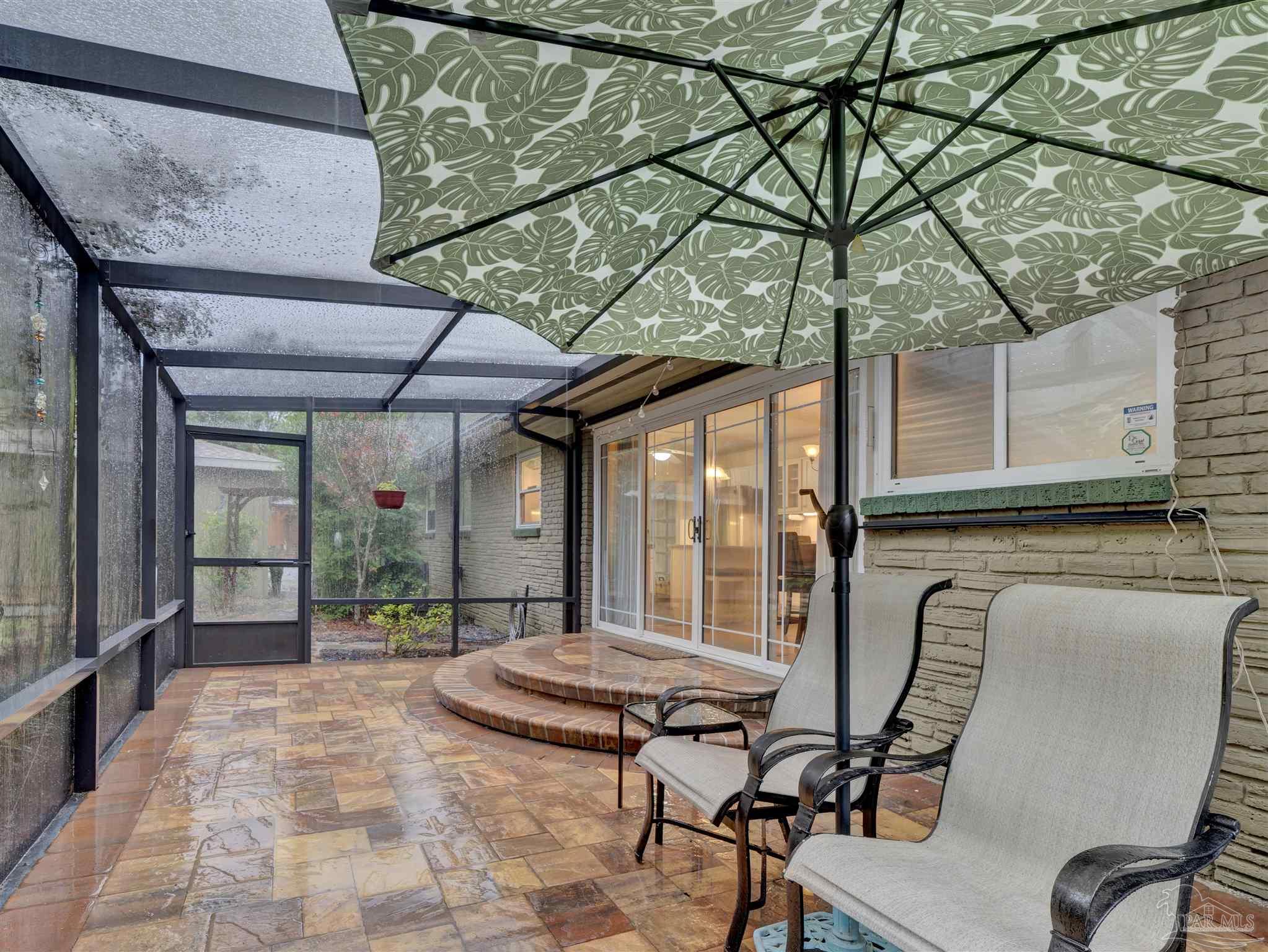 111 Euclid Road Pensacola, FL 32503 - Photo 33 of 34 a view of balcony with two chairs and a umbrella