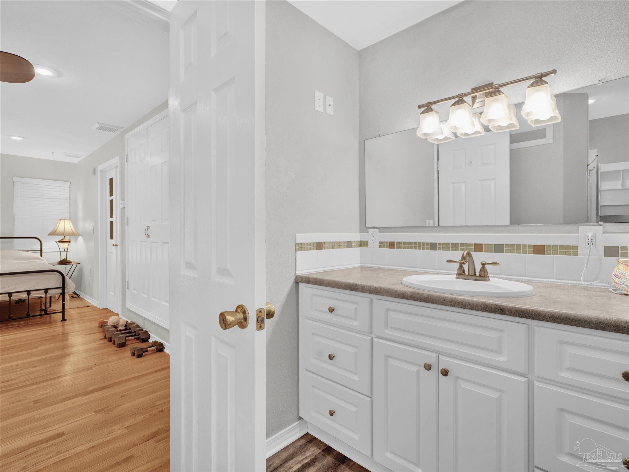111 Euclid Road Pensacola, FL 32503 - Photo 4 of 34 a bathroom with double vanity and a mirror