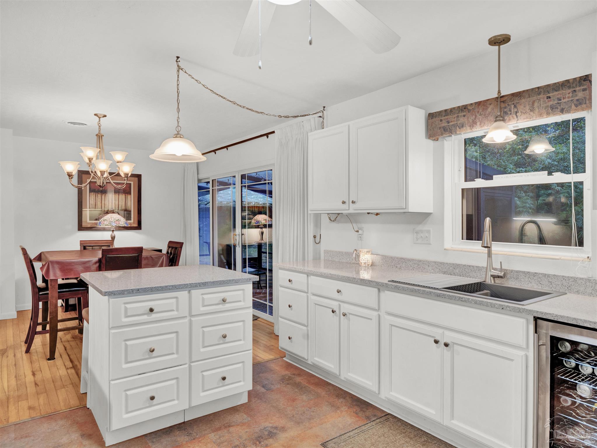 111 Euclid Road Pensacola, FL 32503 - Photo 8 of 34 a kitchen with a stove a sink and a refrigerator