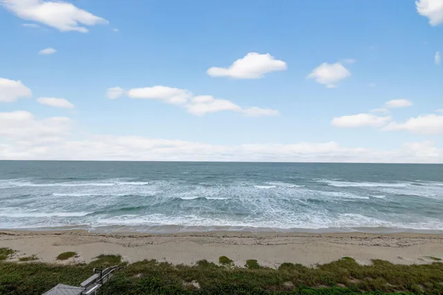 a bathroom with a shower a toilet and a shower