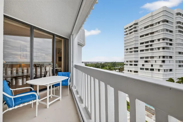 a front view of a house with a yard and a garage