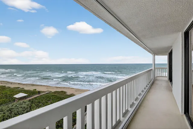 a view of a garden with a building in the background
