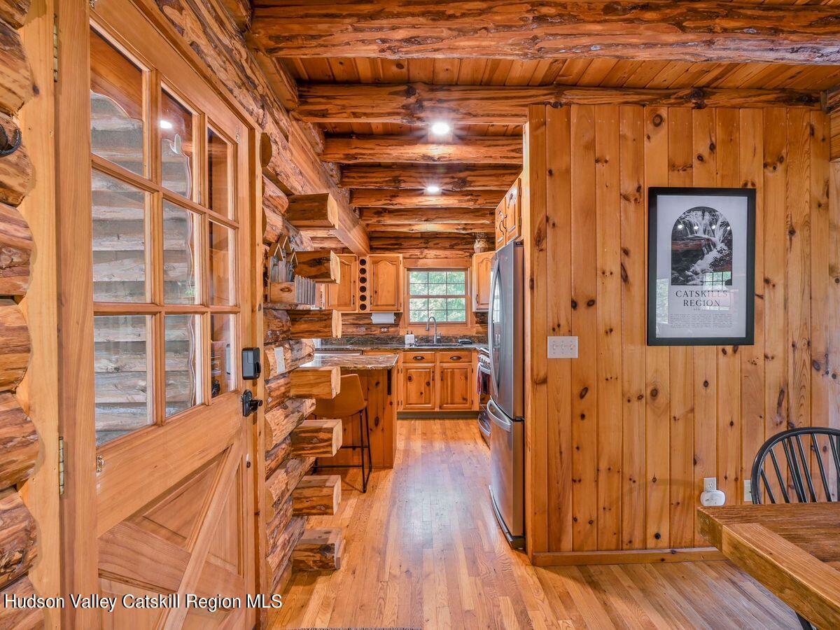 104 Hunter Lane Hunter, NY 12442 - Photo 10 of 36 a view of a porch with wooden floor and furniture