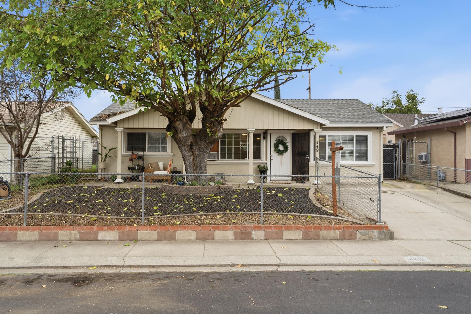 front view of a house with a small yard