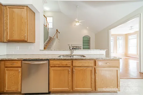 a kitchen with cabinets and window