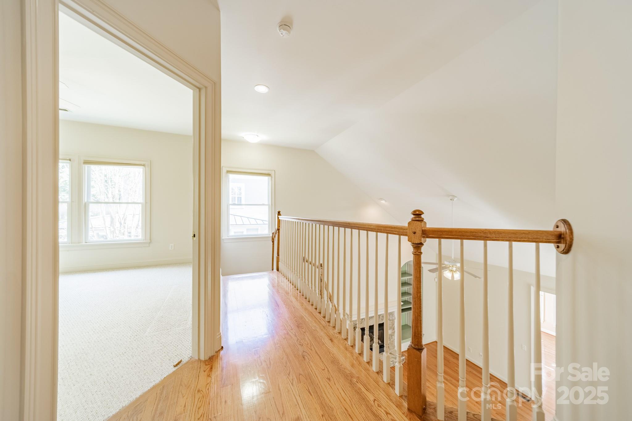545 Glen Walk Drive Fort Mill, SC 29708 - Photo 25 of 48 a view of a hallway with wooden floor and staircase
