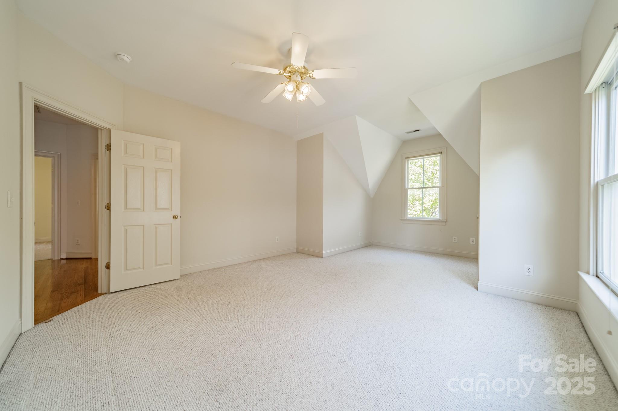 545 Glen Walk Drive Fort Mill, SC 29708 - Photo 27 of 48 an empty room with windows and entrance