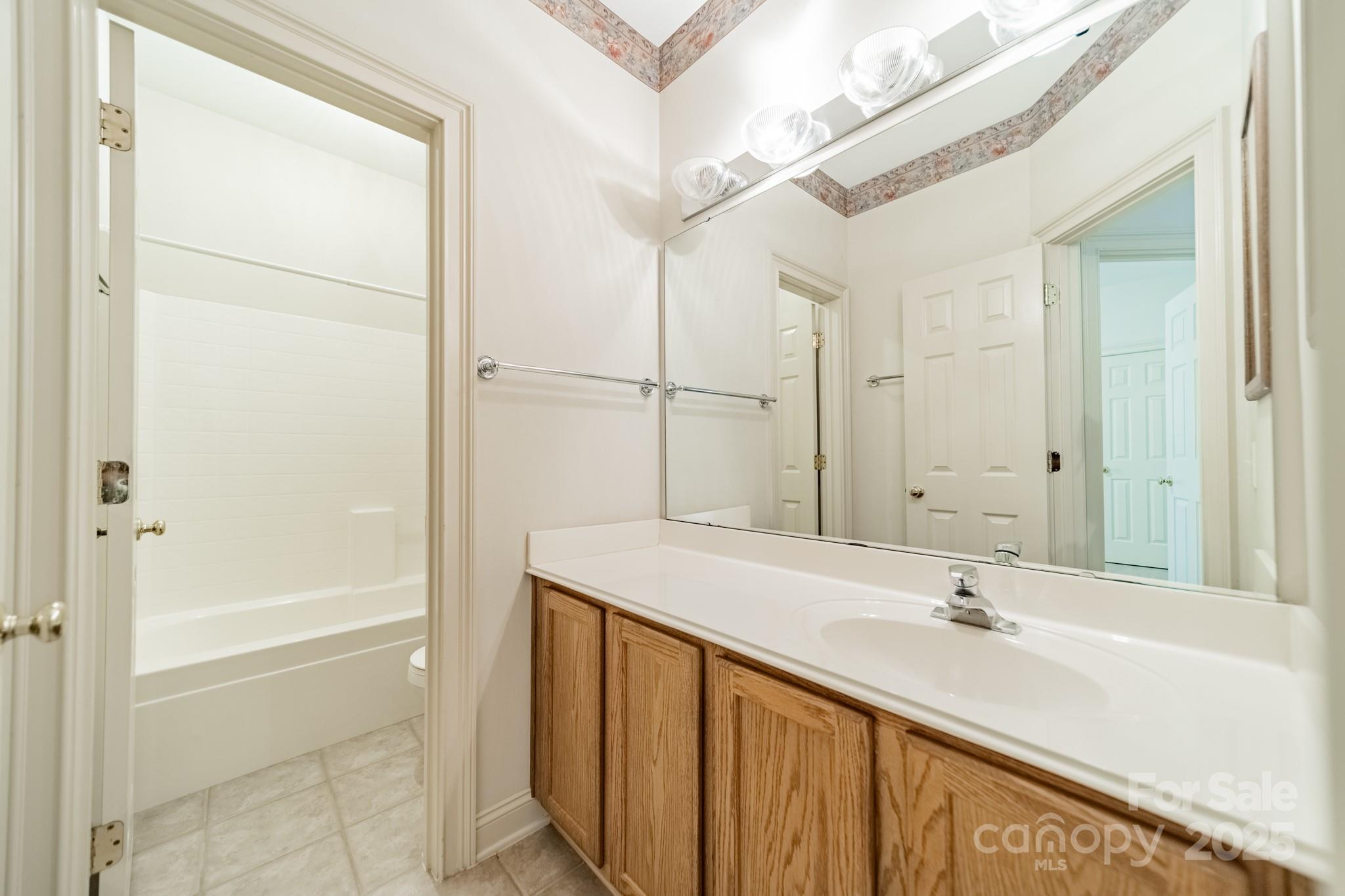 545 Glen Walk Drive Fort Mill, SC 29708 - Photo 28 of 48 a bathroom with a tub sink and mirror