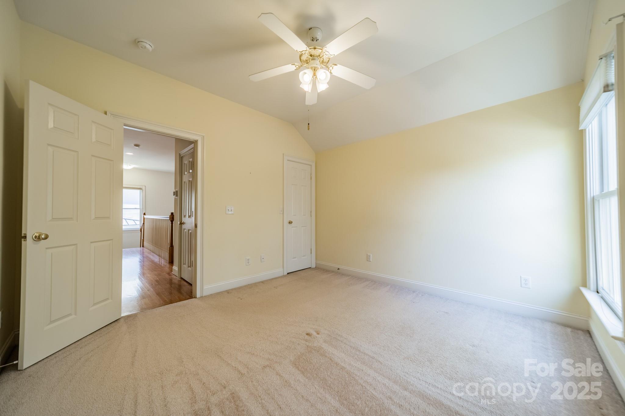 545 Glen Walk Drive Fort Mill, SC 29708 - Photo 32 of 48 a view of a big room with windows and chandelier fan