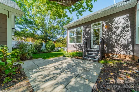 a view of backyard with plants and garden