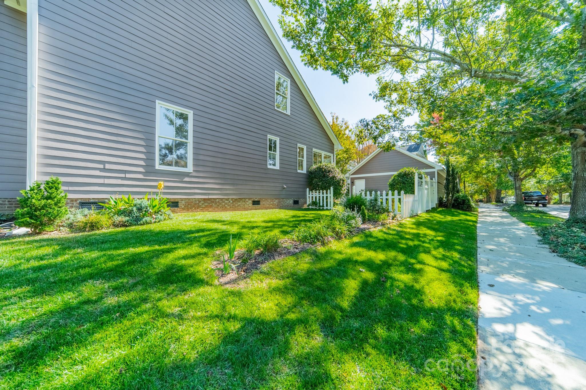 545 Glen Walk Drive Fort Mill, SC 29708 - Photo 40 of 48 a view of a house with a yard and a garden