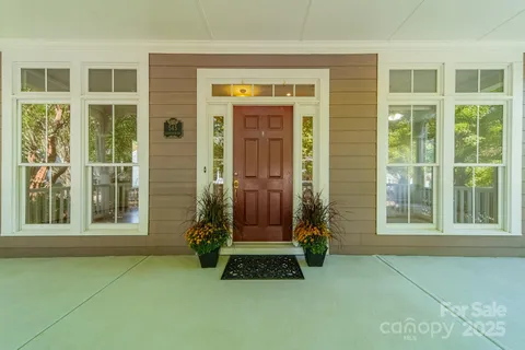 front view of a brick house with a large window