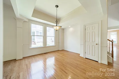 a view of a room with window wooden floor and ceiling fan