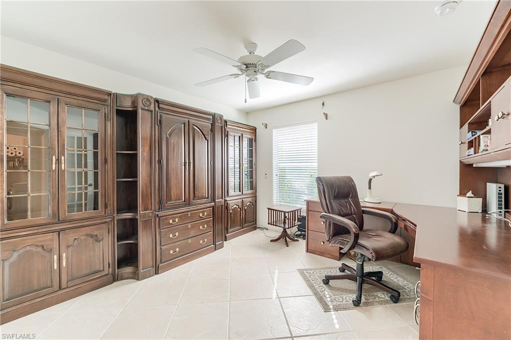 9156 Spring Run Boulevard Estero, FL 34135 - Photo 17 of 34 a work room with furniture and windows