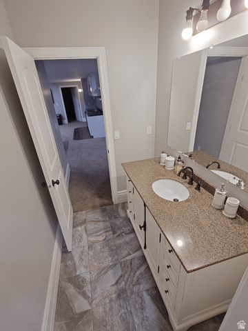 552 Sunset Crest Way Draper, UT 84020 - Photo 55 of 68 Bathroom with vanity and dark marble finish flooring