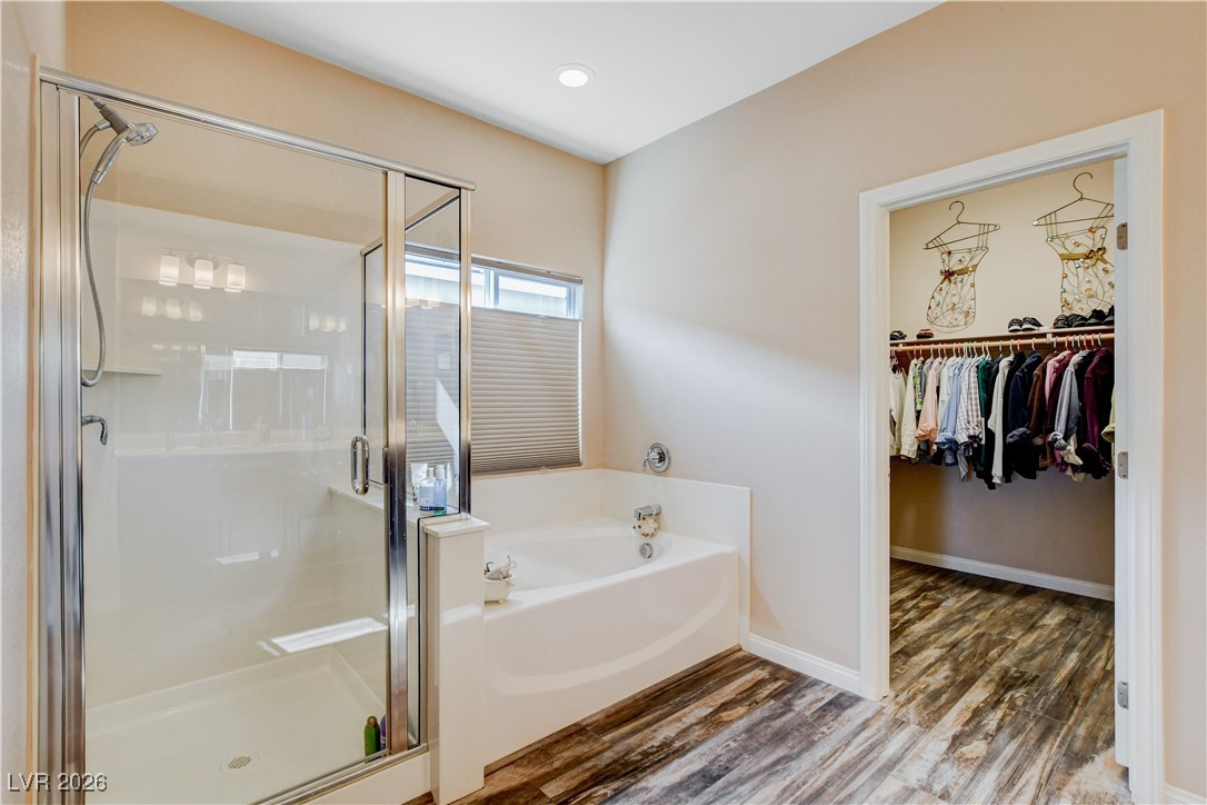 964 Cutter Street Henderson, NV 89011 - Photo 23 of 52 Enjoy the spa like primary suite with separate garden tub and walk-in shower.