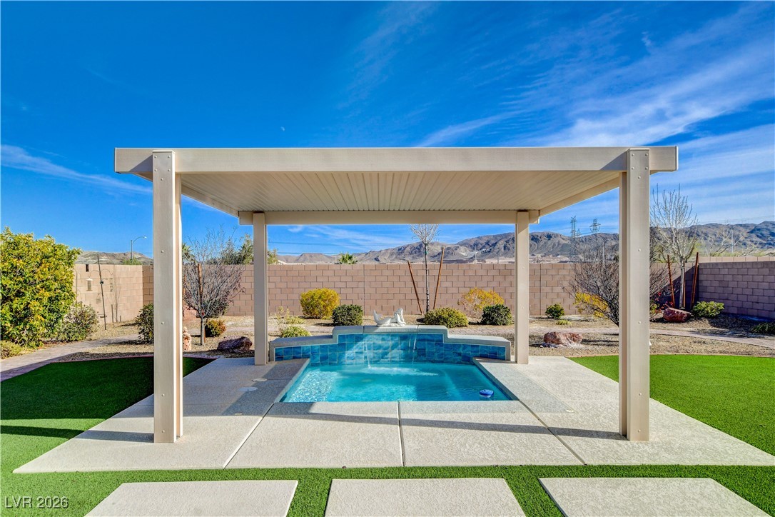 964 Cutter Street Henderson, NV 89011 - Photo 3 of 52 Capture the true southwest in this expansive low maintenance backyard with 11 ft. X 10ft. covered pool/spa while enjoying the great mountain views
