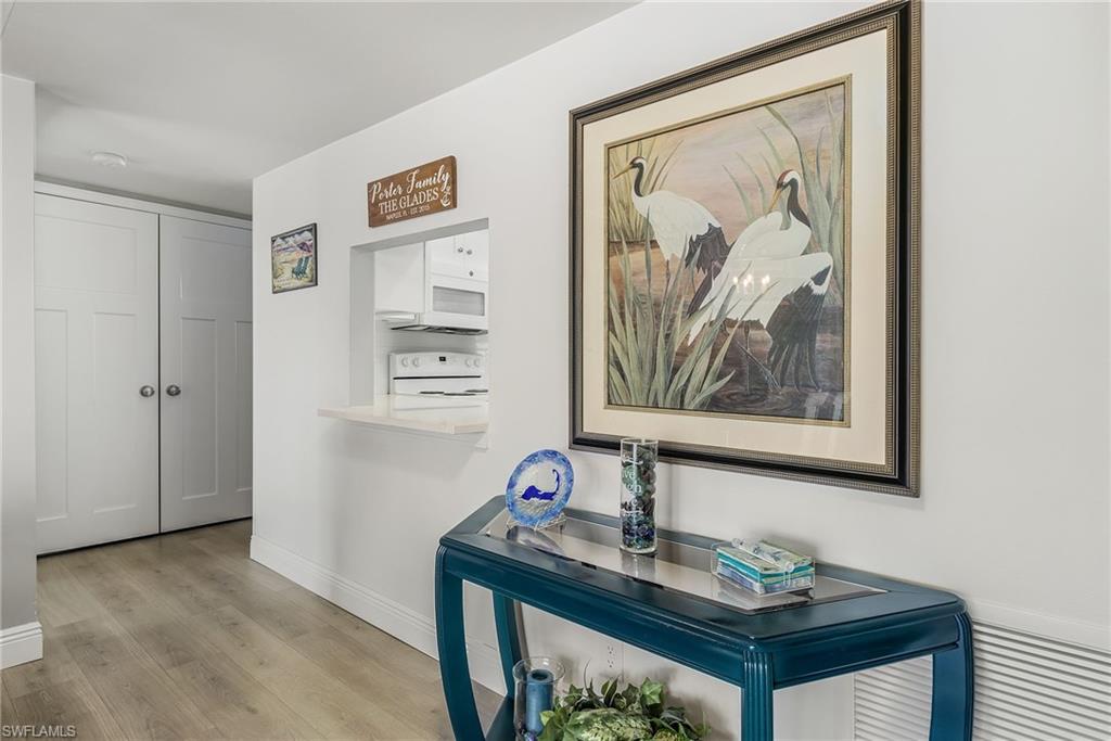 237 Palm Drive, Unit 1 Naples, FL 34112 - Photo 11 of 30 a view of a workspace with painting on the wall
