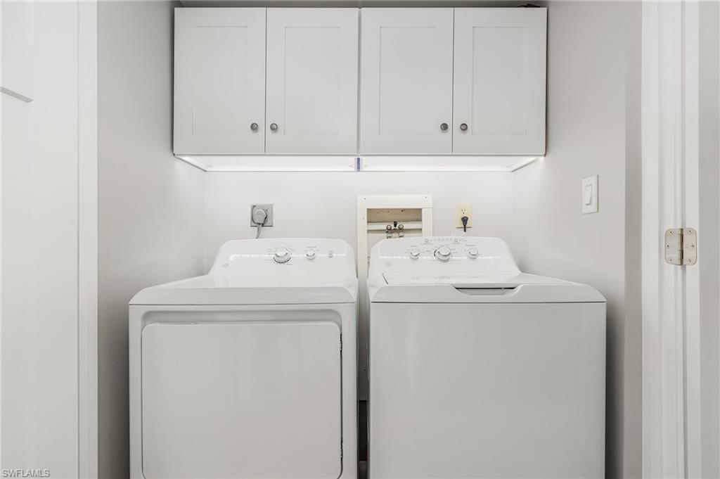 237 Palm Drive, Unit 1 Naples, FL 34112 - Photo 20 of 30 a utility room with dryer and washer