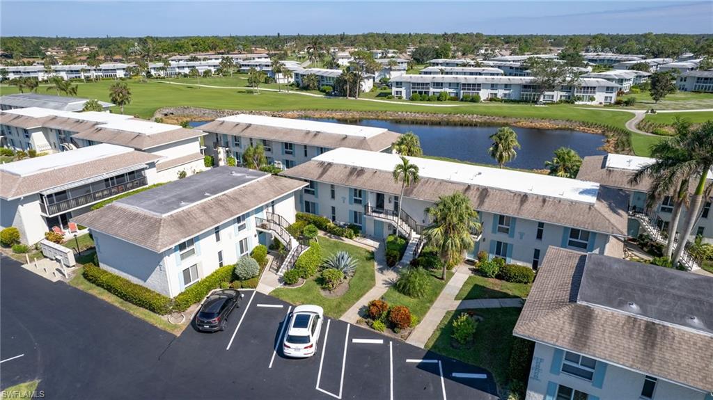 237 Palm Drive, Unit 1 Naples, FL 34112 - Photo 21 of 30 an aerial view of a house with a lake view