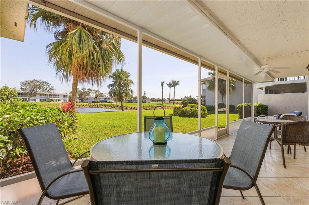 237 Palm Drive, Unit 1 Naples, FL 34112 - Photo 23 of 30 a view of swimming pool with outdoor seating