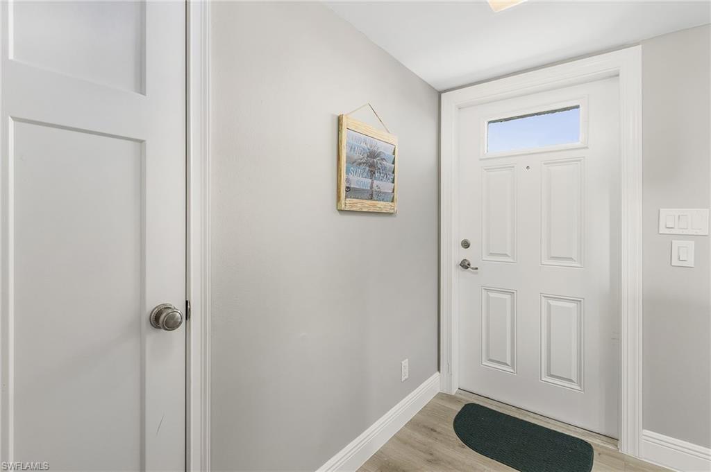 237 Palm Drive, Unit 1 Naples, FL 34112 - Photo 6 of 30 a view of a hallway with closet
